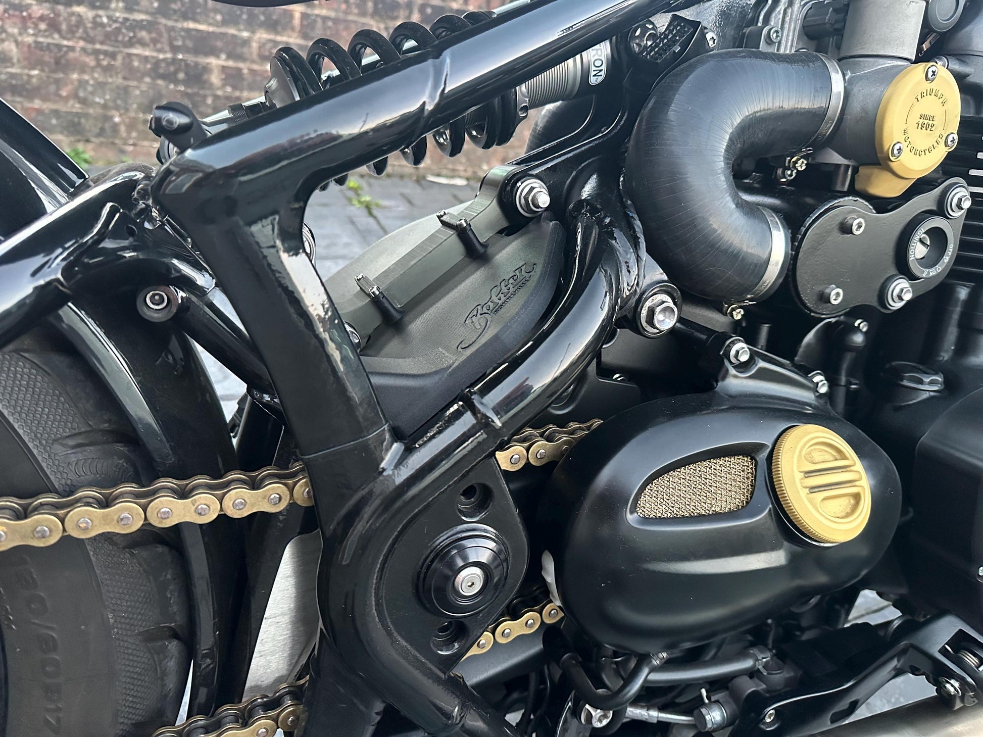 Triumph Bobber wire harness cover installed on motorcycle